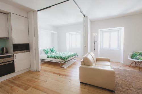 Bedroom, kitchen, and living area | Charming and Modern Living at Loving Chiado 4 in Lisbon