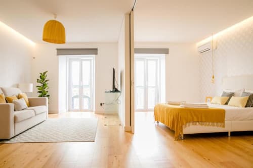 Bedroom and living area | Discover Loving Chiado 7 – A Modern Retreat in Lisbon