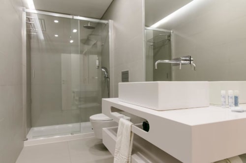Bathroom with shower area | Discover Loving Chiado 7 – A Modern Retreat in Lisbon
