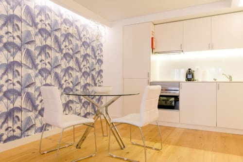 Dining table and kitchen with appliances | Loving Chiado – Your Stylish Stay in the Heart of Lisbon