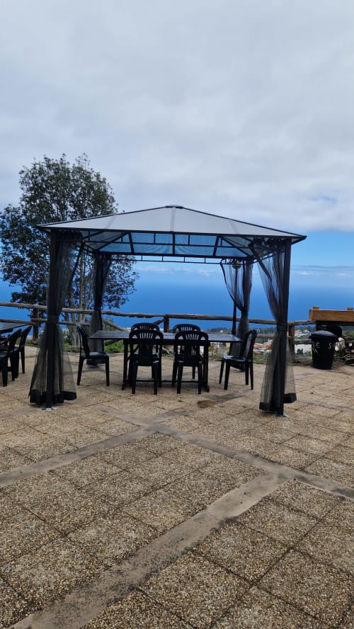 Outdoor gazebo with dining setup overlooking the ocean at Casonas de Marengo, Icod de los Vinos, Tenerife