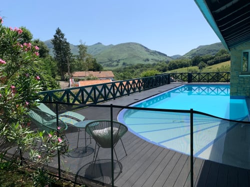 Villa Ongizatea's heated pool terrace with mountain views in Urrugne, France