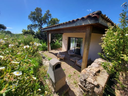 Villas Lantana villa in Lecci with terracotta roof, wooden pergola, private patio, and Mediterranean gardens