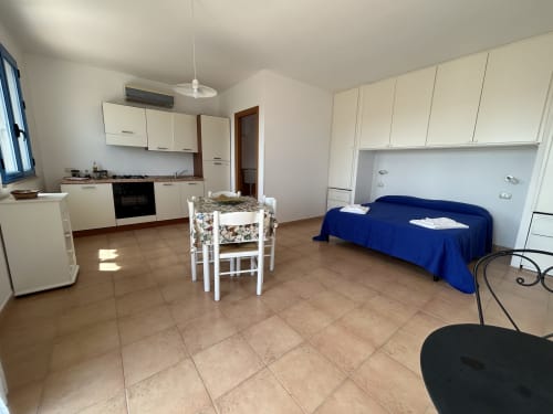 zona letto con angolo cottura