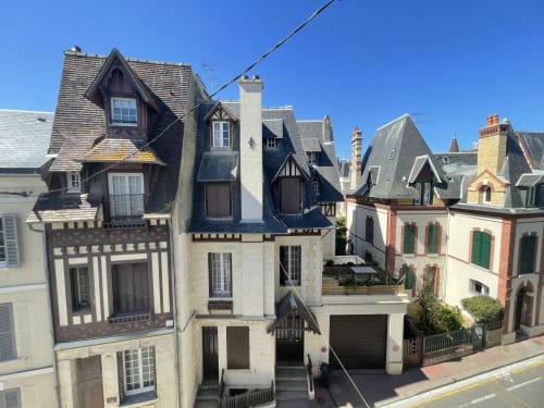 Historic colorful buildings in Trouville-sur-Mer, Hotel Le Trouville's charming coastal French architecture