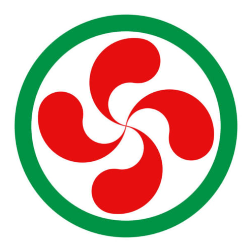 Logo rojo con remolino y borde de círculo verde de Villa Ongizatea, casa rural en Urrugne, Francia