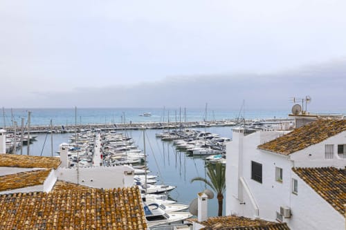 Marbella Puerto Banús marina with white-washed apartments, sailboats, and Mediterranean sea view