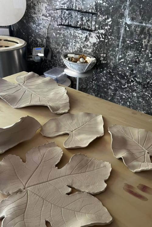 Ceramic leaf-shaped dishes drying in pottery studio at La Cascina di Bea, Bergamo Italy