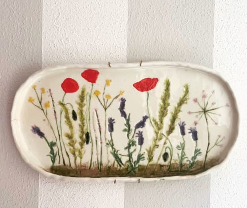Floral wall hanging with red poppies and wildflowers at La Cascina di Bea, Torre Boldone