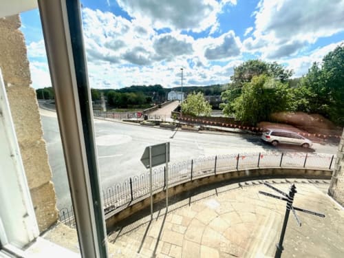 View from John Martin Superior King Room at The Railway Hotel Haydon Bridge overlooking river, bridge, and green hillside