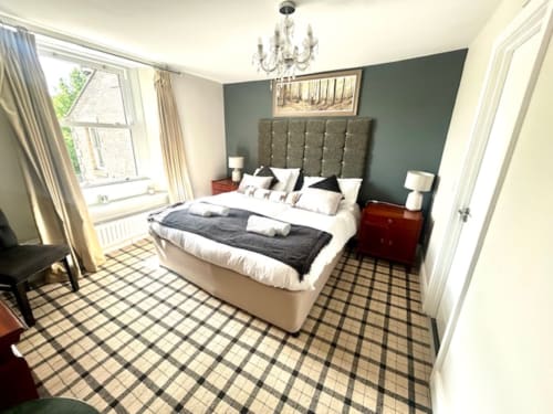 Ratcliffe Superior King Room at The Railway Hotel, Haydon Bridge - elegant bedroom with upholstered headboard, river view