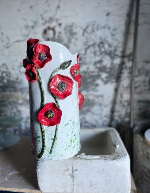 Red poppies painted on white ceramic vase at La Cascina di Bea, Torre Boldone Bergamo