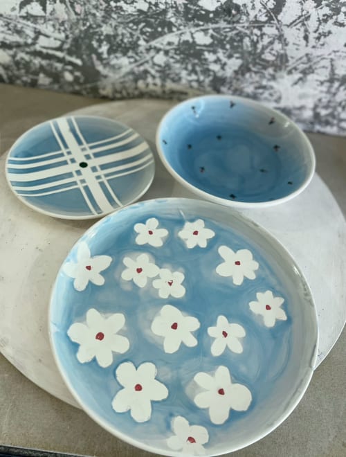 Three blue ceramic bowls with floral and geometric patterns at La Cascina di Bea, Bergamo