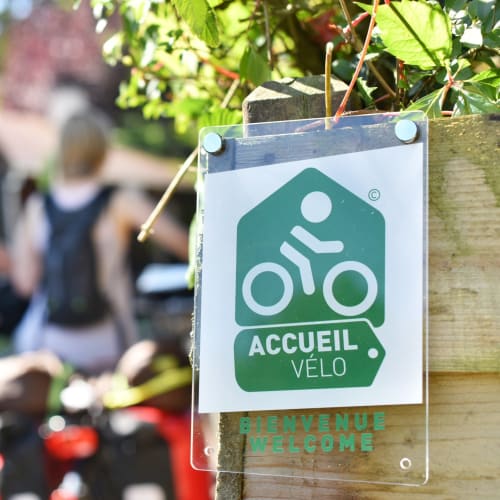 Accueil Vélo bike-friendly welcome sign at Domaine des Piéris guesthouse in Grandcamp-Maisy, France