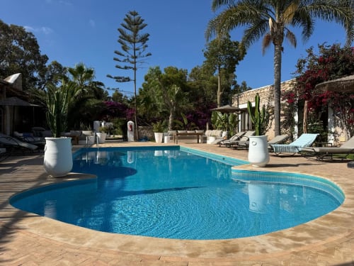 Swimming pool surrounded by bejmat tiles in the patio of Riad Eucalyptus in Essaouira