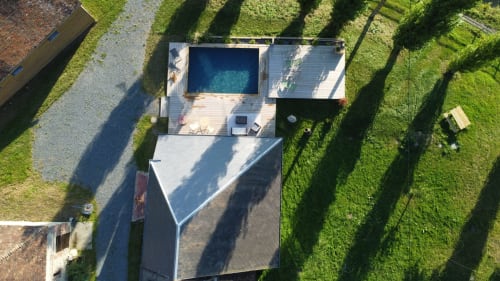Aerial view of Domaine de Blanvatel B&B in Saint Pierre en Auge with pool, deck, and manicured gardens
