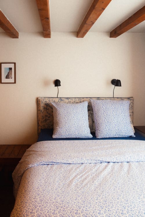 View from inside the "Jouy" bedroom : tailor-made bed frame and vintage linen