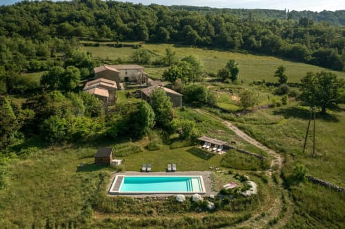 L'Amiradou B&B pool and stone villa in Félines-sur-Rimandoule, France, surrounded by green countryside
