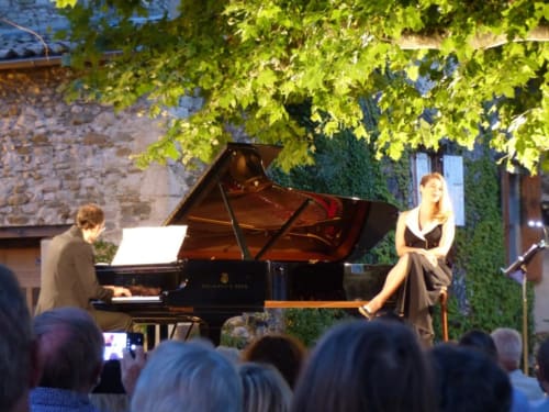 Classical concert performance at L'Amiradou B&B in Félines-sur-Rimandoule, France, with pianist and vocalist under
