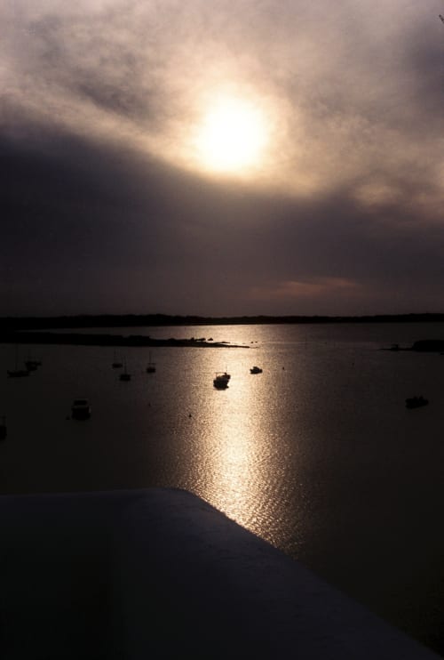 Atardecer sobre el puerto de La Savina con embarcaciones fondeadas, Formentera Especial