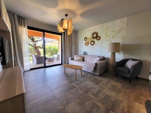 Modern suite at Villas Lantana Lecci with terrace, contemporary furnishings, and coastal views