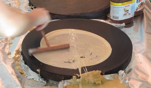 Crepe being prepared on griddle at Espace Ker Gana bed and breakfast in Plourin, France