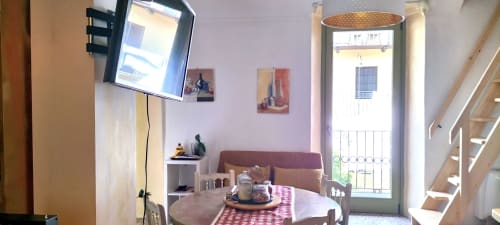 Cozy bedroom at CasaRosada B&B in Vidracco with TV, balcony doors, and garden terrace view