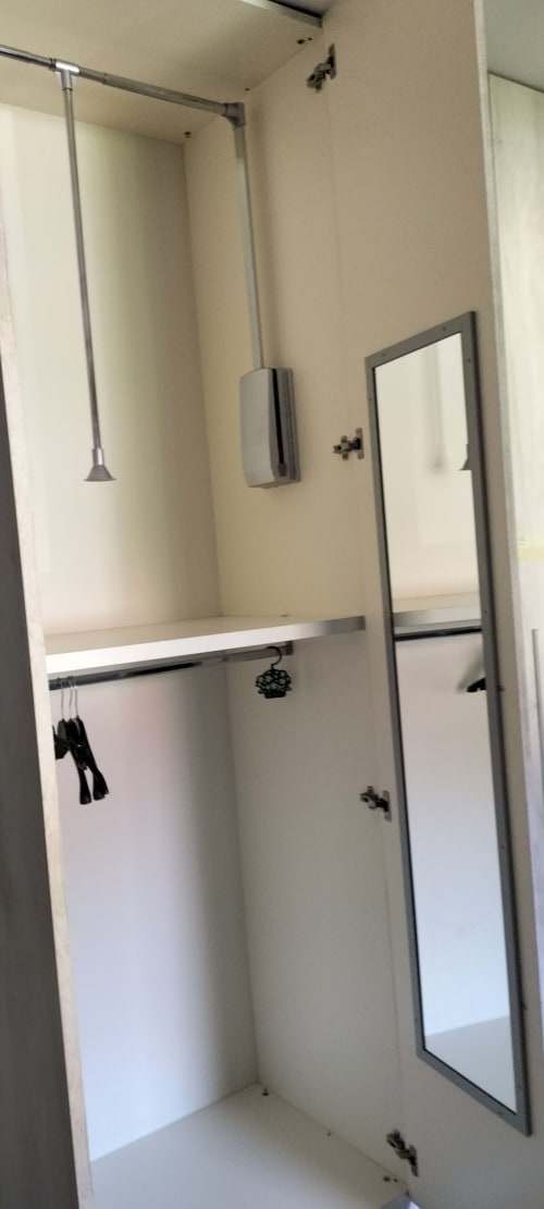 Modern shower enclosure with glass door and rainfall showerhead in CasaRosada wellness retreat bathroom, Vidracco Italy