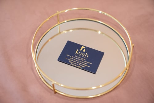 Ruah Pompei hotel business card on elegant gold-rimmed plate, Pompei bed and breakfast