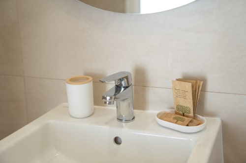 Modern bathroom sink at Ruah Pompei B&B in Pompeii with chrome faucet and eco-friendly amenities