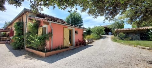 Poppy room exterior at Les Gites de Campardon, a charming red cottage with garden views in Monties, France