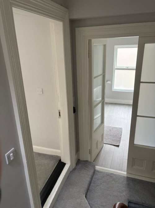 Hallway entrance to Super King room at Eglinton Road Bray with white doors and light wood flooring