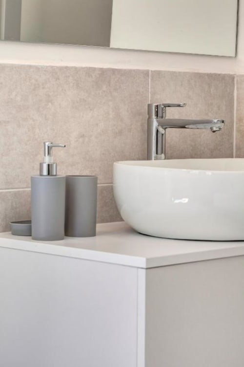 Modern bathroom sink with white ceramic basin and chrome faucet at Palazzo Belvedere hotel suite in Chianciano Terme