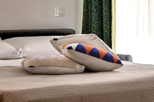 Decorative pillows on bed at Palazzo Belvedere Suite, Chianciano Terme