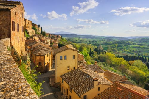 Palazzo Belvedere in Chianciano Terme overlooks rolling Tuscan hills with terracotta roofs and cypress trees
