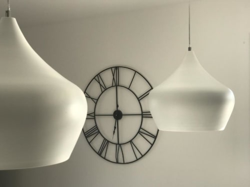 Modern pendant lights and wall clock in Apartment Elegance at Sweet Holiday, Porto-Vecchio