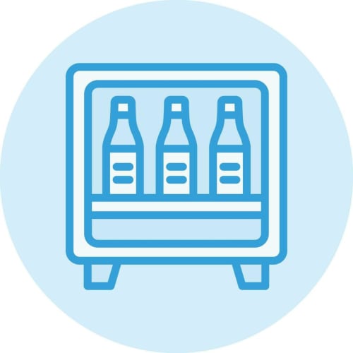 Frigorifero con tre bottiglie di birra presso il bed and breakfast Porta Tosa a Milano