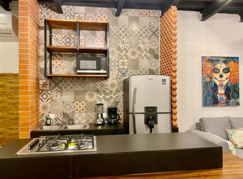 Modern kitchen in Anita Ocean View CUBO apartment, Puerto Vallarta, with patterned backtile, stainless appliances, gas