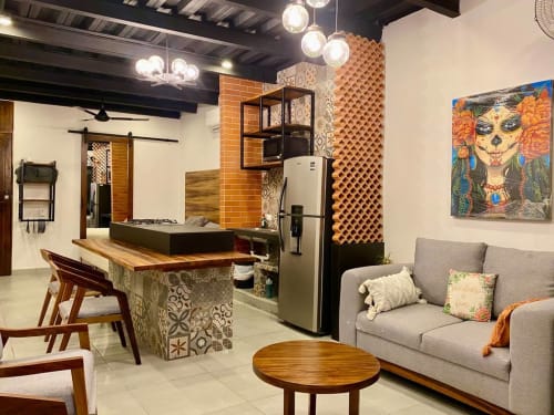 Modern CUBO apartment at Anita Ocean View, Puerto Vallarta with open kitchen, dining area, living room sofa, and contemporary