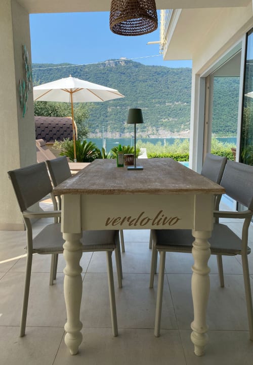 Verdolivo lakeside dining room with mountain view in Sale Marasino, Italy
