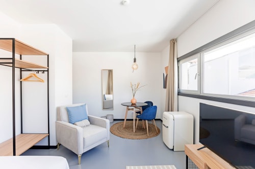 Bright Standard Studio apartment at Benefit Collection Porto with seating area, kitchenette, TV, and modern amenities