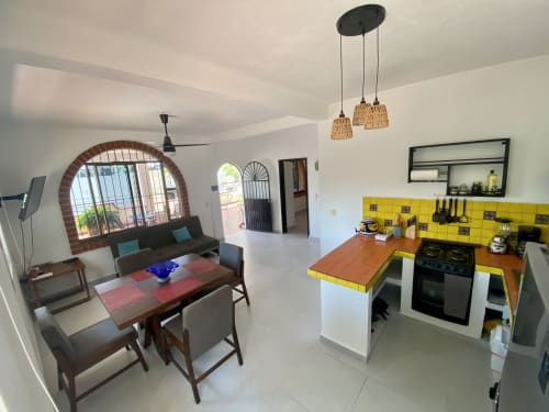 Anita Ocean View apartment in Puerto Vallarta with open-plan kitchen, dining area, living room, and sea view balcony