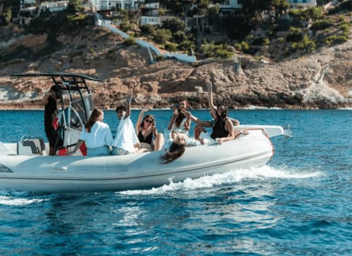 Group of guests enjoying a speedboat excursion off the coast of Marseille near Hôtel Manon, azure Mediterranean Sea and