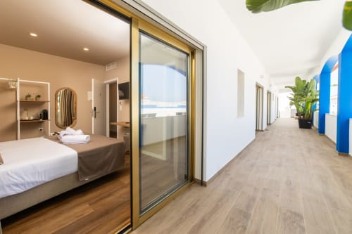 Deluxe Double Room at Alojamento Costa Alentejana with sea view balcony, modern furnishings and corridor access in Zambujeira