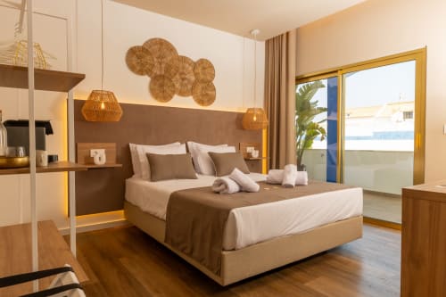 Deluxe Double Room at Costa Alentejana in Zambujeira do Mar with sea view balcony, modern furnishings, and woven decor