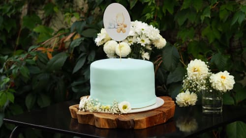 Elegant pale blue celebration cake with floral decorations at Paradise Location, Fort-de-France