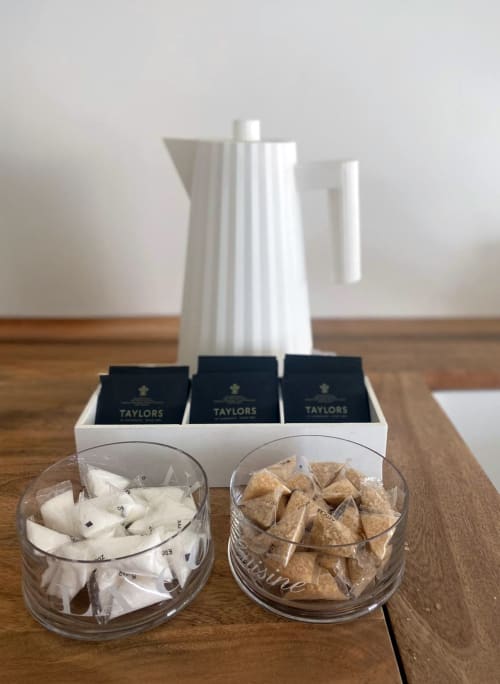 White kettle with Taylors tea boxes and sugar packets at Verdolivo bed and breakfast in Sale Marasino