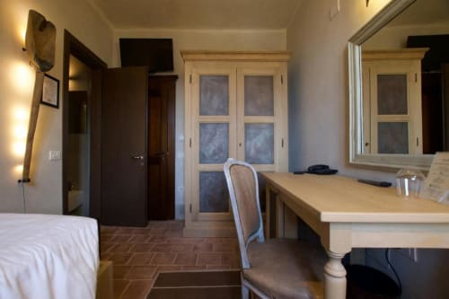 Single room at Hotel San Giovanni Resort in Saluzzo with desk, bed, wardrobe, and garden view