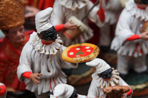 Colorful Italian clown figurines with pizza at I Migliori Artisti B&B, Naples