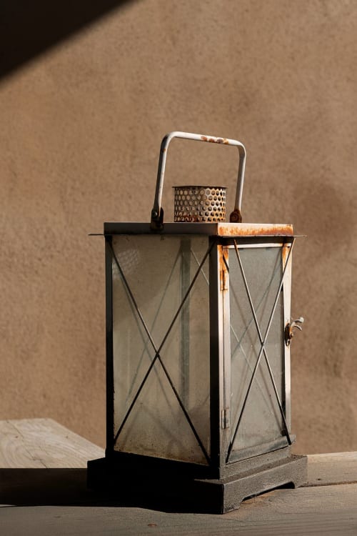Vintage metal lantern with glass panels and rustic metal handle at Mas St André, Saint-Andiol
